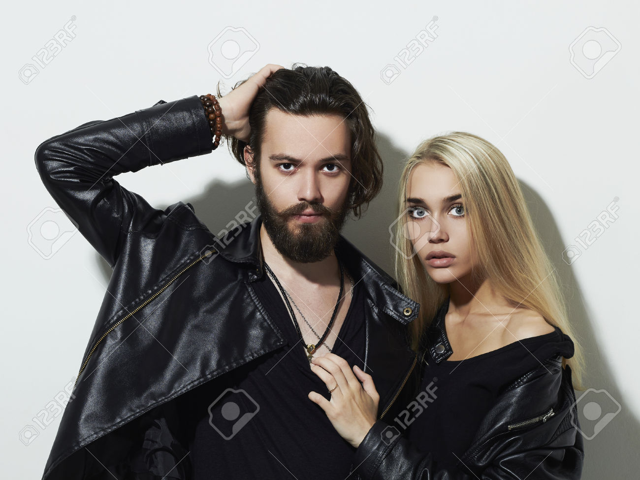 52081499 Hipster boy and girl Bearded young man and blonde model Stock Photo